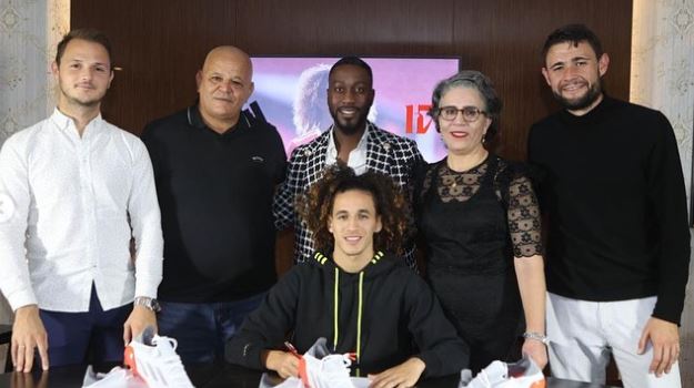 Hannibal Mejbri with his parents while signing a contract with Adidas